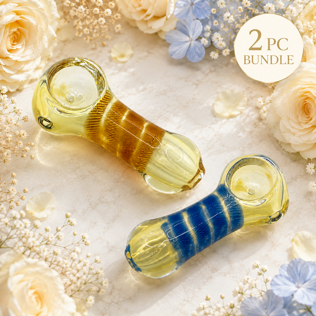 2 piece glass spoon hand pipe bundle in amber and blue stripe designs on floral background