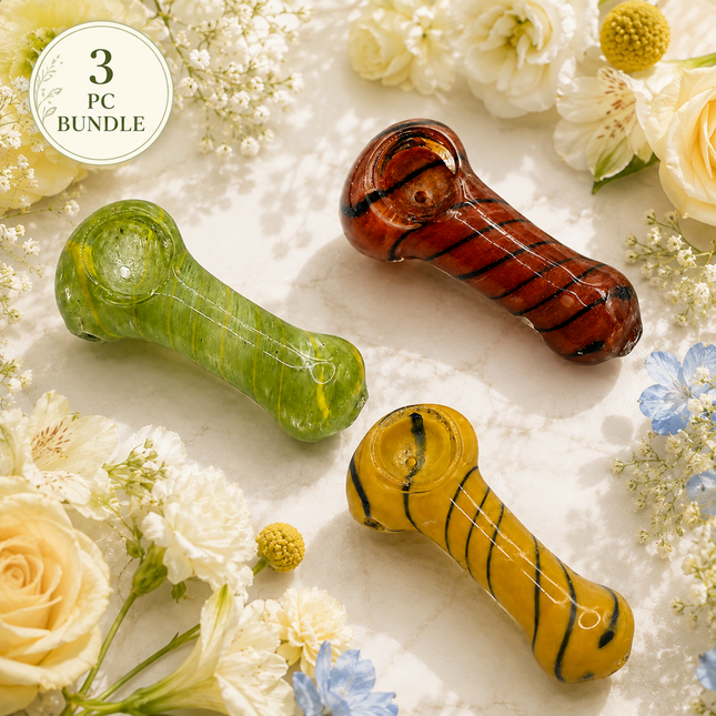 3 piece yellow red and green striped glass spoon hand pipe bundle on a floral background
