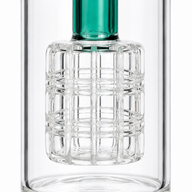 A close-up of a clear glass bottle with a textured, grid-patterned lower section and a translucent green neck at the top, set against a plain white background.