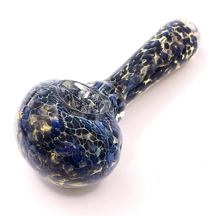 Top angled view highlighting the deep bowl opening, compact spoon shape, and scattered light-colored crackle details.