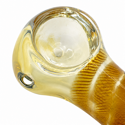 Close-up of amber striped glass hand pipe mouthpiece and glass detail