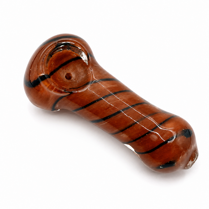 Red brown glass spoon hand pipe with dark spiral stripes on a white background