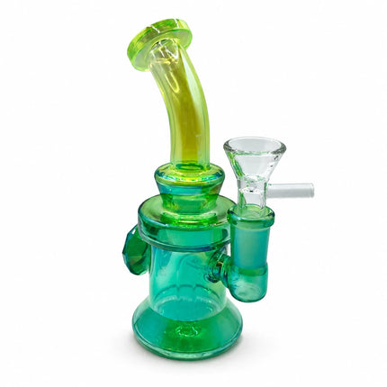 Angled side profile showing the compact emerald body, clear 14mm bowl connection, and decorative green glass features