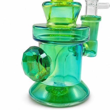 Close-up of the emerald mini bong highlighting its rounded chamber, faceted diamond-style glass details, and vivid green accents