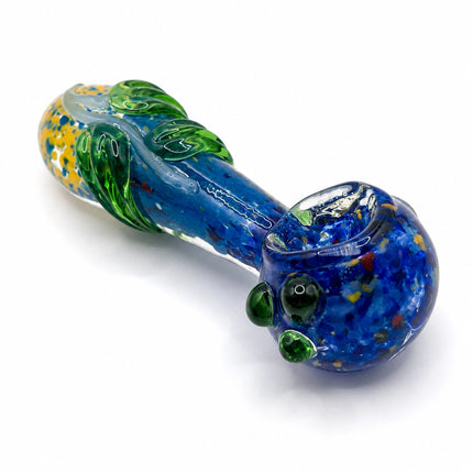 Reverse three-quarter angle highlighting the thick glass body, layered blue-green swirls, and rounded spoon shape