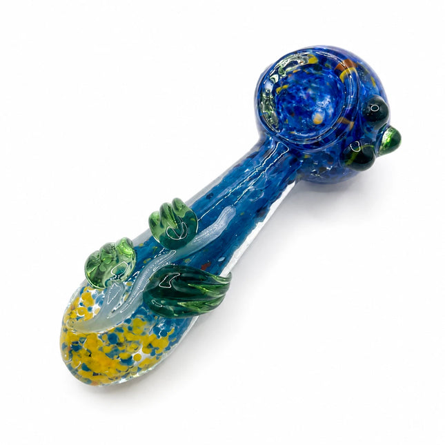 Angled studio view showing the deep blue bowl, green leaf-like accents, and yellow-speckled mouthpiece detail