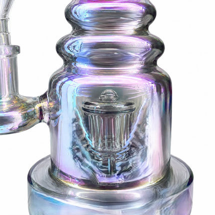 Close-up of the cylindrical chamber highlighting the reflective iridescent finish and internal glass filtration detail