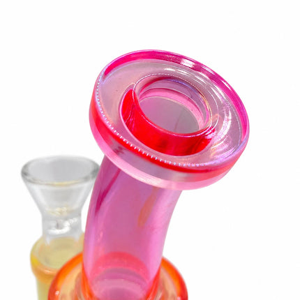 Close-up top view of the bright pink bent mouthpiece showing the rounded opening and glossy translucent glass finish
