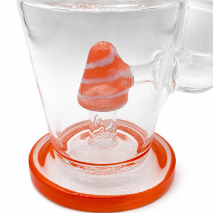 Lower chamber detail highlighting the orange cone perc, clear glass body, and vivid orange foot ring
