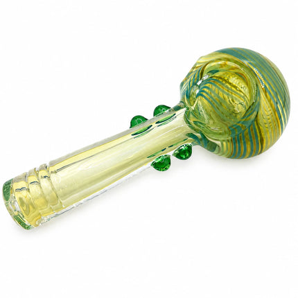 Reverse diagonal view emphasizing the layered lime swirl pattern across the rounded bowl and clear tapered stem
