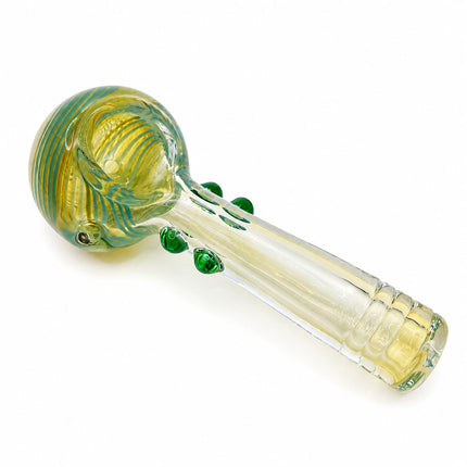 Angled studio view highlighting the rounded honeycomb bowl, clear stem, and raised emerald grip dots