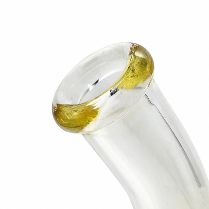 Close-up of the curved neck and mouthpiece showing the soft amber tint and smooth glass finish