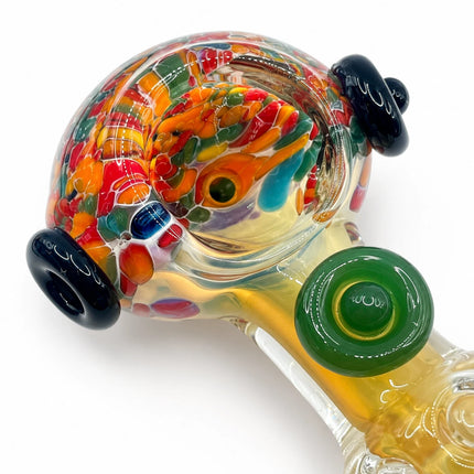Side detail of the thick glass body with black raised accent and layered colorful swirl pattern
