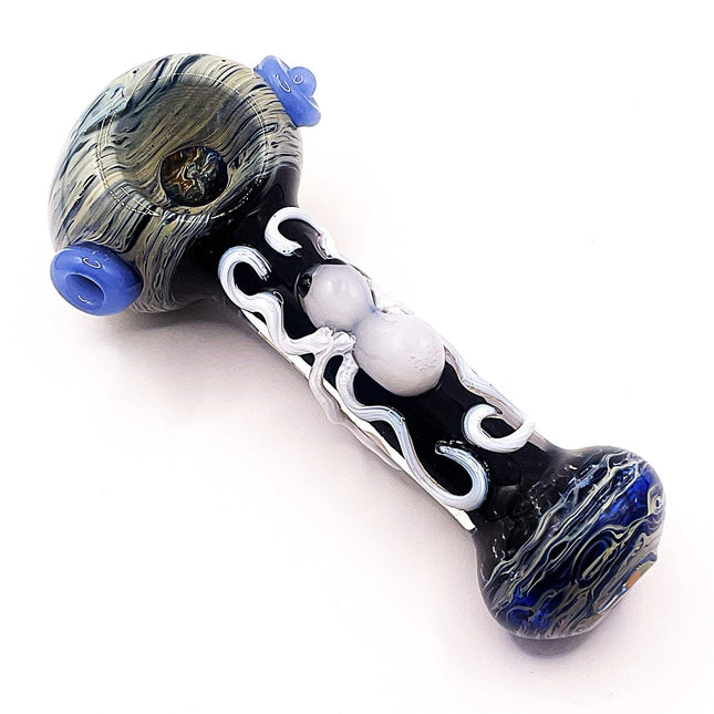 5-inch black glass spoon pipe with white spider artwork, smoky marbled bowl, and cobalt blue accent marbles on a white background
