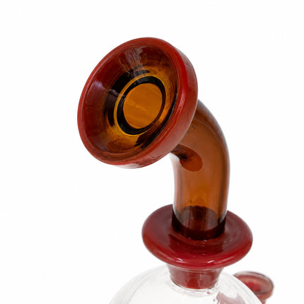 Close-up of the curved neck and flared mouthpiece in deep red-brown glass on the mushroom percolator bong