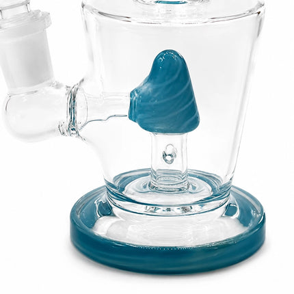 Close-up of the teal cone-shaped percolator inside the clear chamber and round teal base of the glass water pipe