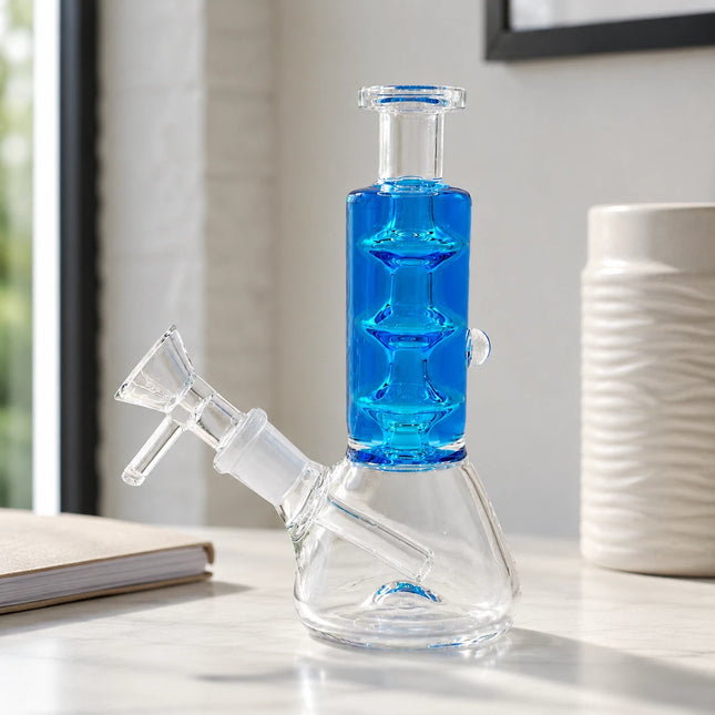 Cobalt blue glycerin stack glass water pipe with clear beaker base and angled bowl displayed on a bright neutral countertop