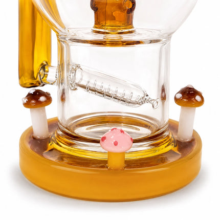 Detailed view of the lower chamber and amber base of the 10-inch glass water pipe with visible inner glasswork