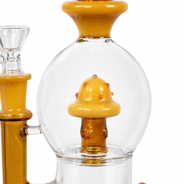 Close-up of the upper chamber and amber mushroom percolator inside a clear round glass body