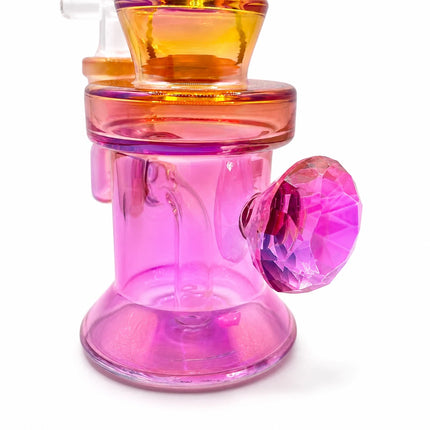 Detailed side view of the pink base and chamber with yellow chrome accent ring and rounded side handle detail