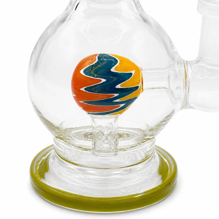 Macro shot of the round chamber highlighting the colorful orb perc design and green base accent
