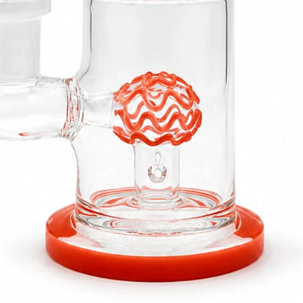 Detailed macro shot of the orange dome percolator inside the clear chamber and matching orange base ring