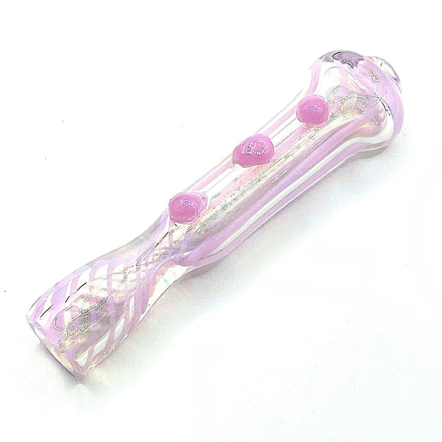 Diagonal studio view highlighting the translucent pink body, rounded ends, and evenly spaced grip dots