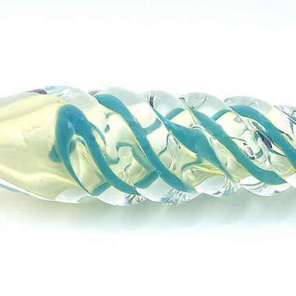 Close-up detail of the raised teal ribbon pattern crossing over the clear glass surface.
