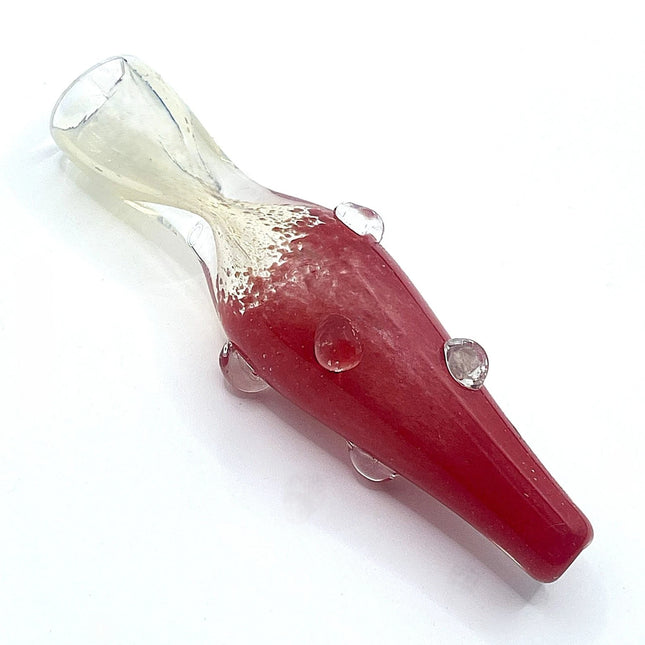 Diagonal studio view highlighting the ruby red body, transparent mouthpiece, and subtle glass texture