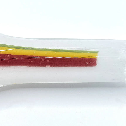 Close side detail showing the three-color stripe running cleanly through the transparent glass body.