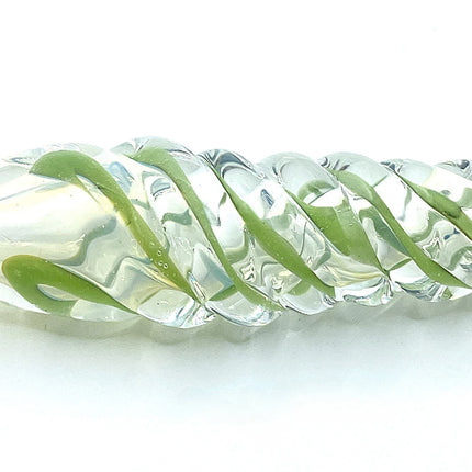 Close side view of green spiral glass chillum pipe showing twisted raised glass accents on a pure white background