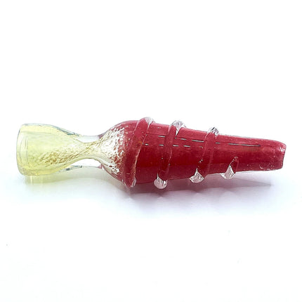 A glass wine aerator stopper with a textured red body, clear glass ridges, and a pale yellow textured bowl on a white background.