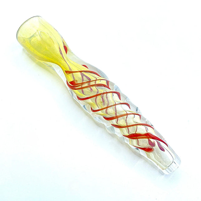 Diagonal studio view showing the pale mouthpiece and intertwined red-gold glass ribbons along the transparent body.