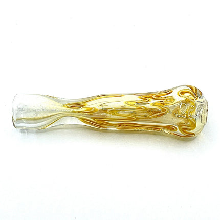 Side angle of a 3 inch topaz-toned glass chillum pipe showing its tapered shape and twisted color detail
