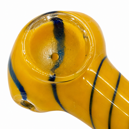 Close-up of yellow striped glass spoon pipe bowl and side carb hole